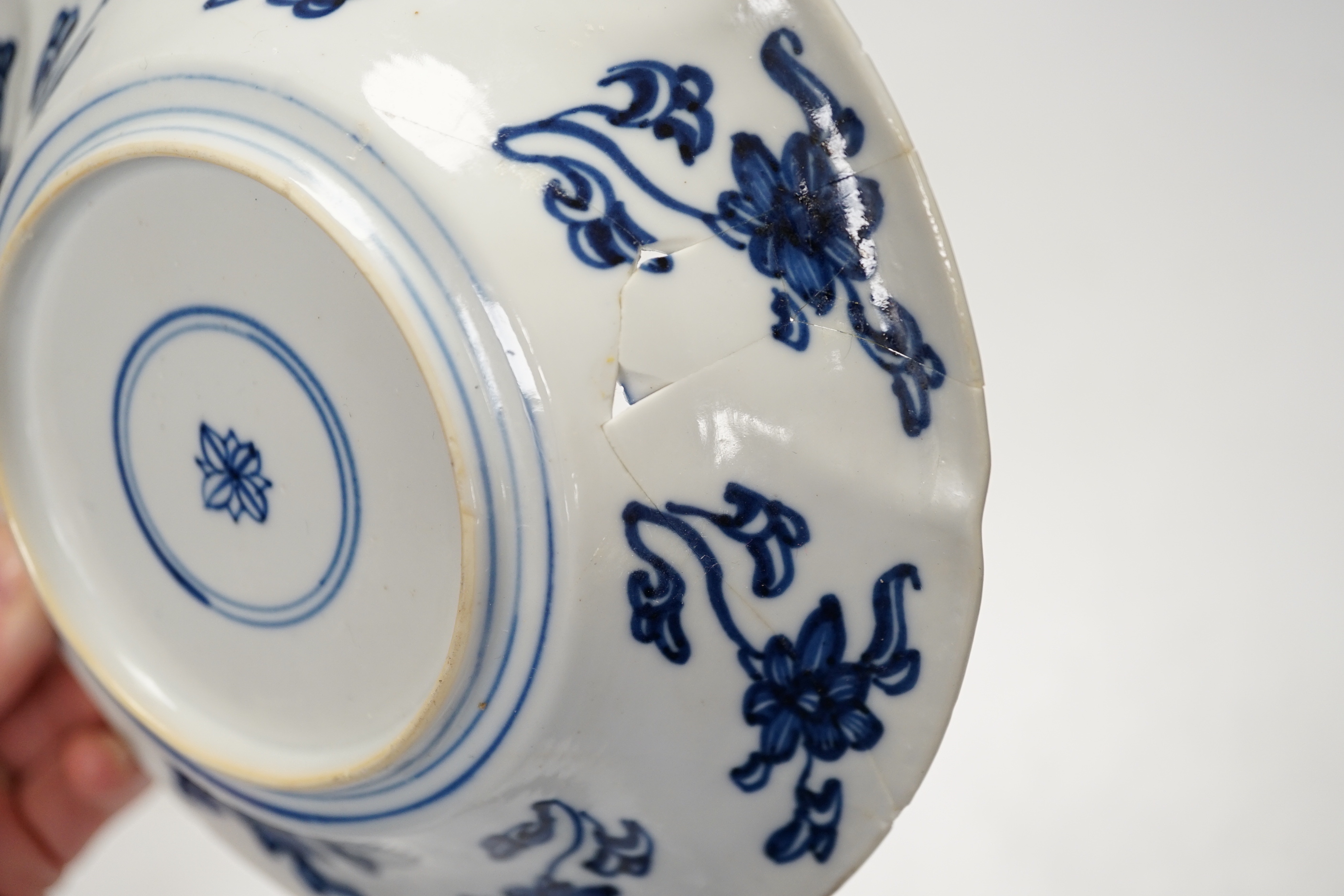 An 18th century Chinese export blue and white dish together with two others, largest 26cm